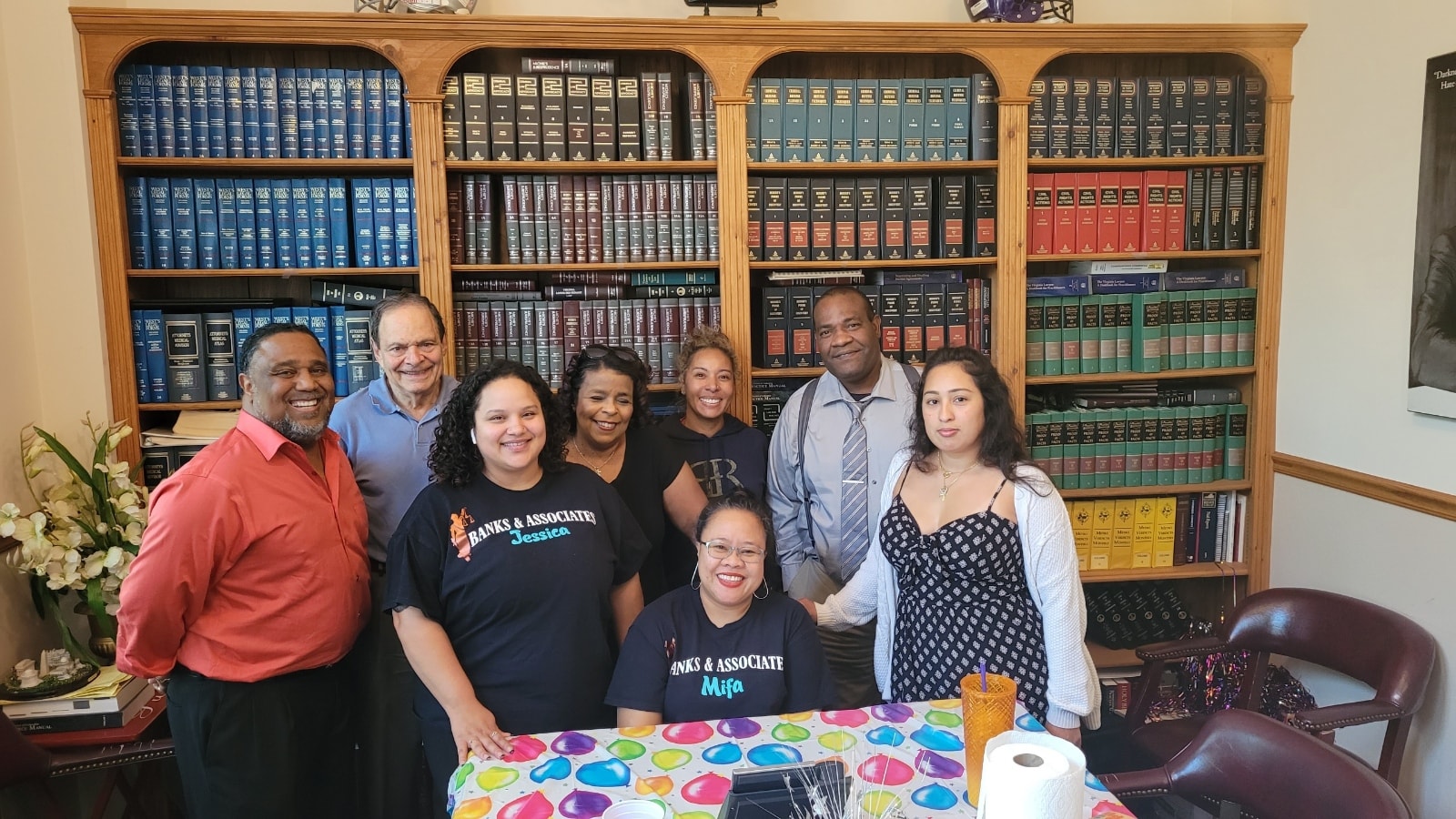 Banks and Associates law office team gathered in the library