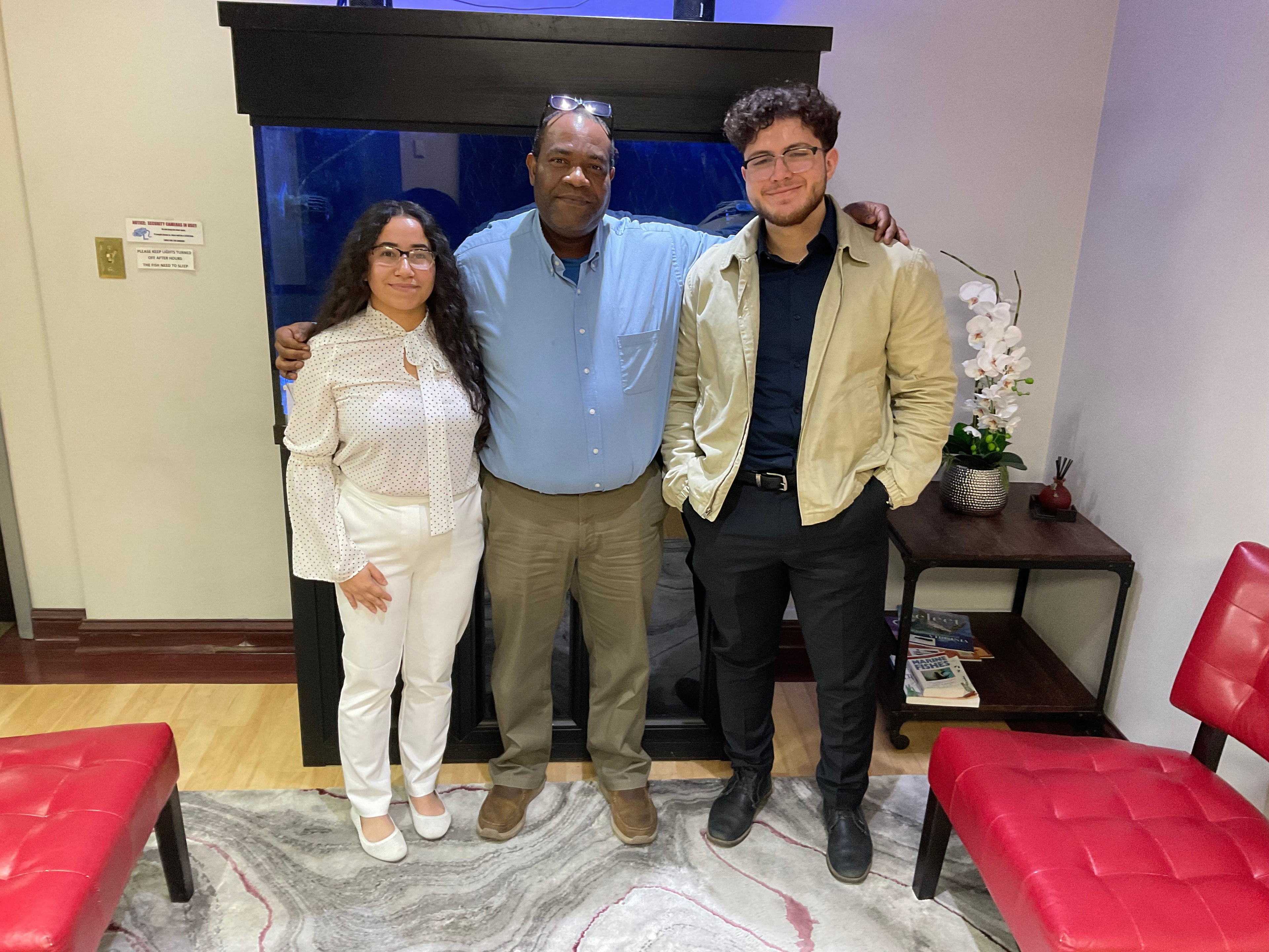 Attorney Jarrett with two clients in the office lobby