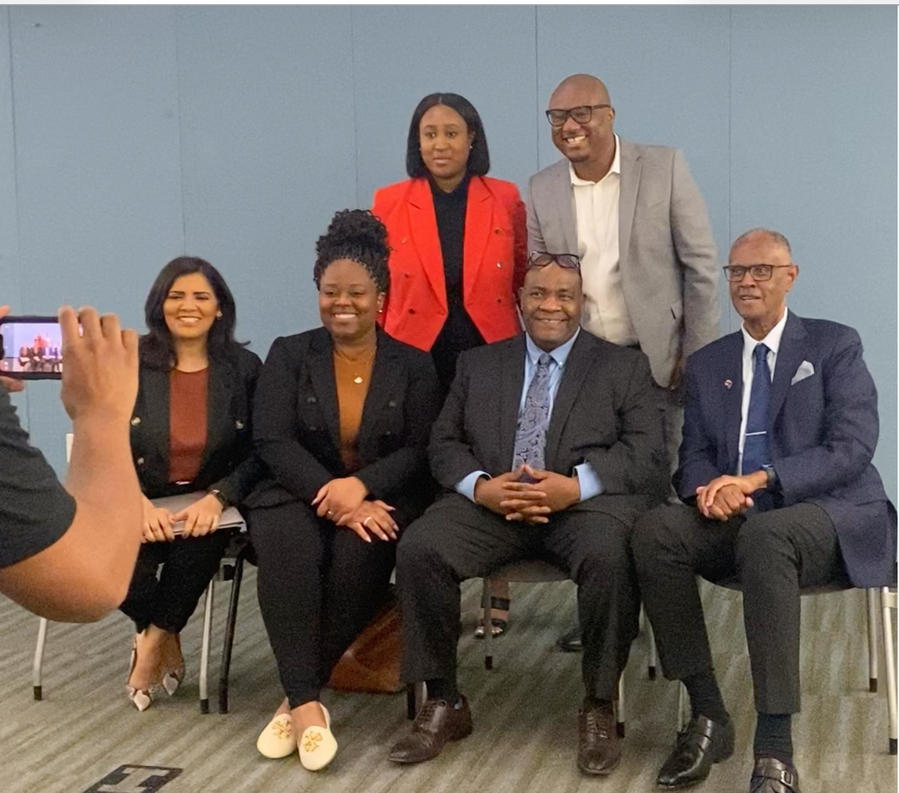 Panel group of six professionals at a community event